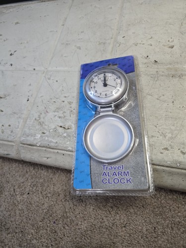 New travel alarm - new,